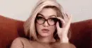 surprised lady lowering glasses