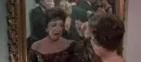 lady looking in mirror crying