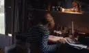 lady pounding head on desk