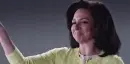 lady wagging her finger with a smile