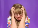 lady screaming, pulling at her hair