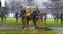Beyonce marching threw stadium with girls