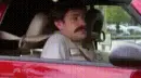 man reclining in car