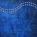 INDIGO BLUE JEAN BACKGROUND WITH WHITE STITCHING