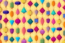 YELLOW BACKGROUND WITH MULTI COLORED SHAPES