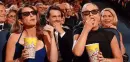 ladies eating  popcorn