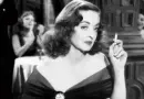 old time movie star smoking watching something
