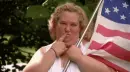 lady blowing kiss with American Flag