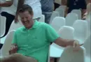 green shirt man laughing