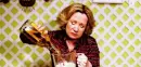 lady shaking her head, pouring bottle of alcohol 
