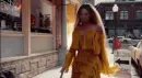Beyonce smashing bat on sidewalk, creating fire