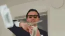 man throwing money out