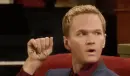 man showing his hand saying "You're A Jerk!"