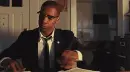 man looking at papers, angry pounding the table