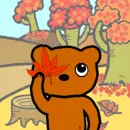 bear playing with leaves