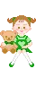 small green doll sitting with teddy bear