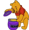 Pooh opening his honey