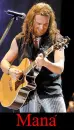 Fher playing his guitar, from Mana