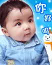cute baby boy looking at the snow falling