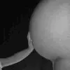 childs hand on pregnant belly