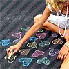 girl drawing hearts
