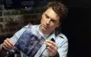 Captain Jack Harkness reading on the Cybermen.