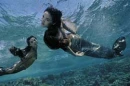 Mermaids Swimming.