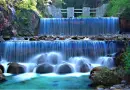 waterfalls one on top other on bottom then a pond of water