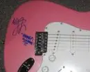 autographed miley guitar