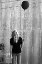 girl with black baloons