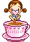 baby in a pink cup