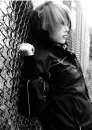 Emo Girl against chain link fence