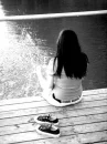 girl with feet in the water
