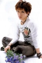 Gackt with purple flowers.
