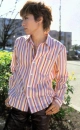 Gackt in a pink shirt.