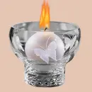 burning candle in candle holder