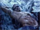 Man in waterfall.