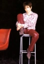 Gackt on a stool.