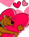 scoobidoo in love hugging a pillow