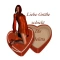 Woman kneels on heart