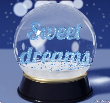 A snow globe on a black base with Sweet dreams in blue glitter letters, at night